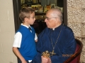 Koraes student with Father Byron