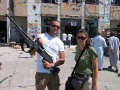 With a freedom fighter at Bab-al-Aziziya, Tripoli, 2011